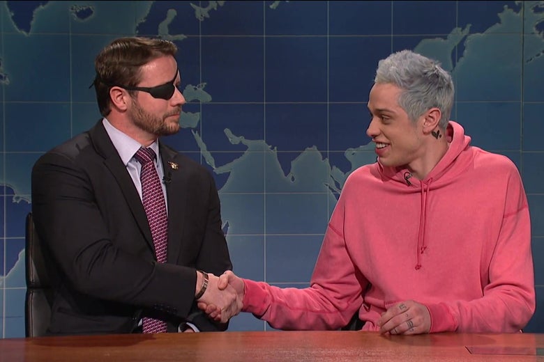 Dan Crenshaw shakes hands with Pete Davidson.